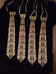 three ties with different faces on them are hanging from a black t - shirt,