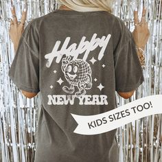 Comes in kids sizes too! The perfect comfy cozy oversized shirt for a family or Girl's Night In New Year's Eve! The shirt says 2024 on the front and has a large disco ball / mirrorball retro mascot design on the back. It's printed on a soft, high quality garment-dyed Comfort Colors® T-shirt for a vintage, worn-in feel.  *SIZE AND FIT* Comfort Colors® shirts are unisex sized t-shirts that run true to size. Size up one size for an oversized fit, or two sizes for a 'shirt dress' look. It's always a Retro Mascot, Matching Christmas Shirts, Mascot Design, Comfy Cozy, Disco Ball, Nouvel An, Oversized Shirt, New Year's, Night In