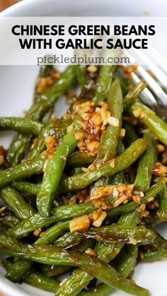 chinese green beans with garlic sauce in a white bowl