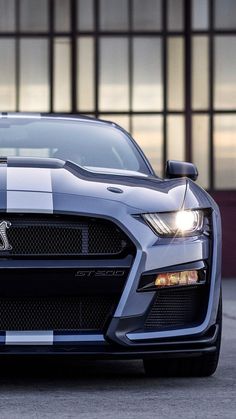 the front end of a silver sports car