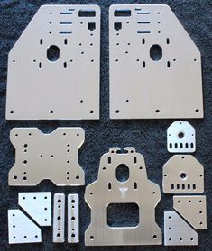 metal parts for the front and rear part of a car, including two large pieces