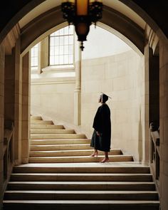 a person standing at the top of some stairs