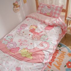 a child's bedroom with pink and white bedding, teddy bears on the comforter