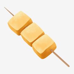 three pieces of yellow marshmallow on a toothpick