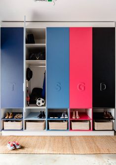 an organized closet with colorful doors and shoes on the bottom shelf in front of it