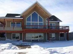 a large house with snow on the ground