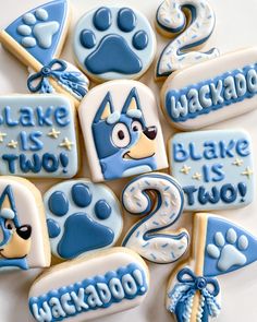 decorated cookies with blue frosting and white icing