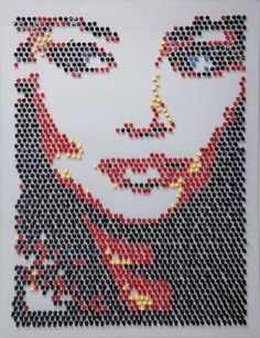 a close up of a face made out of plastic beads