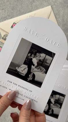 a person holding up a wedding album with photos on it and the words save the date