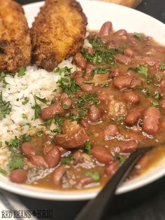 a white plate topped with beans and rice