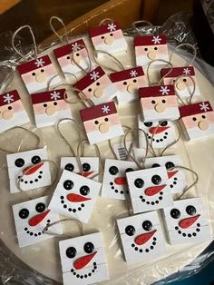 snowman and santa clause gift tags on a table