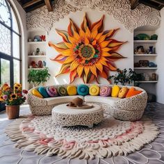 a large sunflower is mounted on the wall above a white couch with colorful pillows