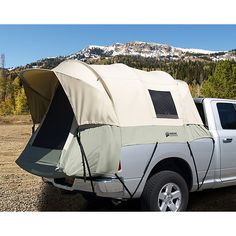 a truck with a tent attached to the bed