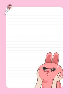 a pink bunny holding up a blank paper