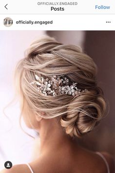 the back of a woman's head wearing a wedding hair comb