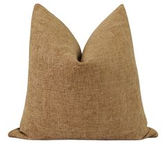 a brown pillow on a white background