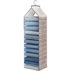 a cardboard hanging storage unit with blue pillows