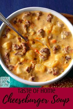 a white bowl filled with cheeseburger soup on top of a blue table cloth