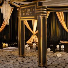 an elaborately decorated room with gold and white drapes