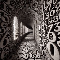 an image of a tunnel with numbers and letters all over it in black and white