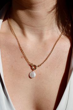 "PRODUCT DETAILS: *Length: 18\" *Chain: Rolo Chain *Clasp: Front Sailors Clasp *Stone/Crystal: Fresh Water Pearl *Gold: 14k Gold Filled *Tarnish-resistant, waterproof, and safe for sensitive skin All our jewelry is made from gold-filled materials that won't tarnish or turn your skin green. From the beginning of launching MWW DESIGNS, we wanted to create high-quality and affordable jewelry for our customers. Using materials such as gold-filled allows us to bring beautiful jewelry to you that is tarnish-resistant, waterproof, and safe for sensitive skin. EDUCATION: Gold-filled jewelry is created through a heating process by bounding a thick layer of gold onto a base metal, usually brass or copper. Gold-filled contains 5% of solid gold, compared to 0.5% for gold-plated jewelry, which makes th Sailor Clasp Necklace, Front Clasp Necklace, Skin Education, Jewelry Stack, 2023 Accessories, Jewelry Clasps, Stacked Jewelry, Pretty Clothes, Fresh Water Pearl