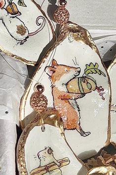 several decorative dishes with animals painted on them