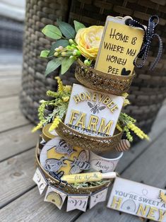 there is a small tower made out of items on the table with words written on it