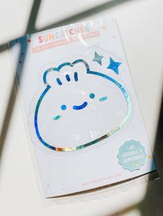 the sticker on the package is shaped like a hippo face with stars around it