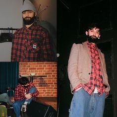 a man in plaid shirt and jeans standing next to a brick wall