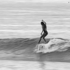 a person riding a surfboard on a wave in the ocean