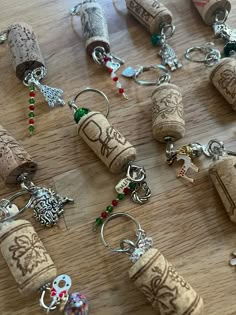 wine corks and charms are arranged on a table