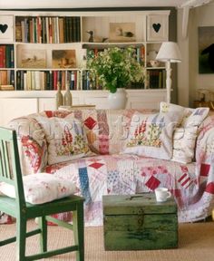 a living room filled with furniture and lots of books