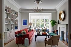 a living room filled with furniture and a fire place