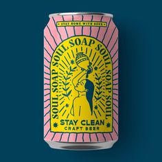 a pink and yellow can of soap on a blue background