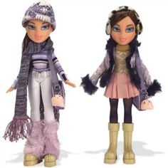 two dolls wearing winter clothes and hats