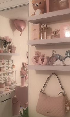 a pink purse is hanging on the wall next to shelves with personal care items in it