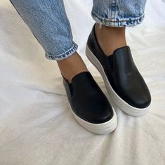 Black leather slip on shoes with white sole that are easy to wear and very comfortable while walking. They are made from full grain leather, the sole is made from rubber and the total quality promises the best footwear experience. Find them only at Chrtistina Christi store. 👉 My Leather Shoes Collection: https://etsy.me/3TS9NJ2 👉 Express Shipping: https://etsy.me/3ikUnOM DESCRIPTION - Outside and inside with real leather. - Rubber Sole 3.5 cm height. - Made in Greece SIZE PROPOSAL - Normal to Comfortable Black Slip-ons With Leather Sole, Black Slip-ons With Leather Footbed, Black Casual Slip-ons With Contrast Sole, Sporty Leather Slip-ons With Vulcanized Sole, Black Leather Footbed Slip-ons, Black Casual Slip-ons With Leather Sole, Black Leather Slip-ons With Textured Sole, Black Leather Slip-on Sneakers With Textured Sole, Black Leather Slip-ons With Stitched Sole