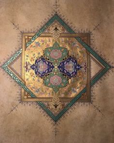 an intricately designed ceiling with gold and blue accents on the top half of it