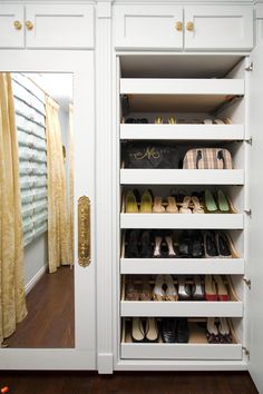 the closet is full of shoes and purses