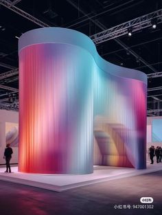 a large colorful structure is on display at an exhibition