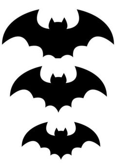 three bats that are black and white, one has four different colors on the wings