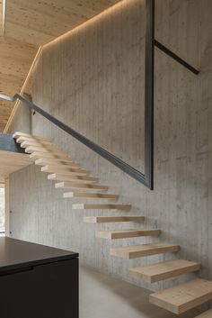 the stairs are made of wood and have metal handrails