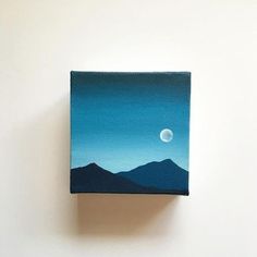 an acrylic painting of the moon over mountains