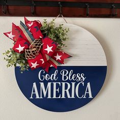 a blue and white sign that says god bless america