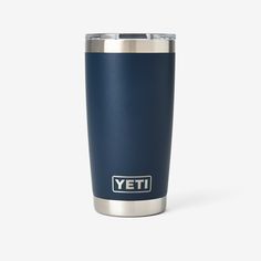 the yeti travel mug is shown in blue and silver with white lettering on it