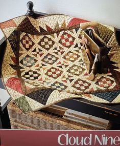 there is a book about quilts on the table