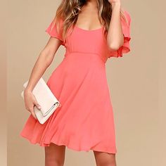 This Coral Pink Skater Dress Is Always Ready For Any Special Occasion That Comes Its Way! Lightweight Woven Fabric Forms Fluttering, Elasticized Sleeves Atop A Darted Bodice, Fitted Waist, And Flaring Skater Skirt. Tying Back, Plus Hidden Back Zipper. Lined. 100% Viscose. Hand Wash Cold Pink Ruffled Fit And Flare Mini Dress, Solid Color Flutter Sleeve Dress For Day Out, Pink Flowy A-line Mini Dress, Pink Fit And Flare Mini Dress, Flirty Style, Pink Fit And Flare Mini Dress, Pink Flirty Fit And Flare Mini Dress, Flirty Pink Fit And Flare Mini Dress, Pink A-line Flirty Midi Dress, Pink A-line Mini Dress For Brunch