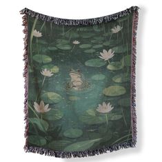 a tapestry with a frog in the water surrounded by lily pads