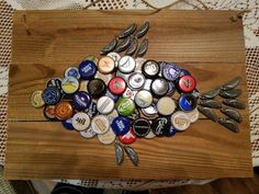 a wooden table topped with lots of bottle caps