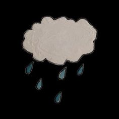 an image of a cloud with raindrops in the dark sky above it on a black background